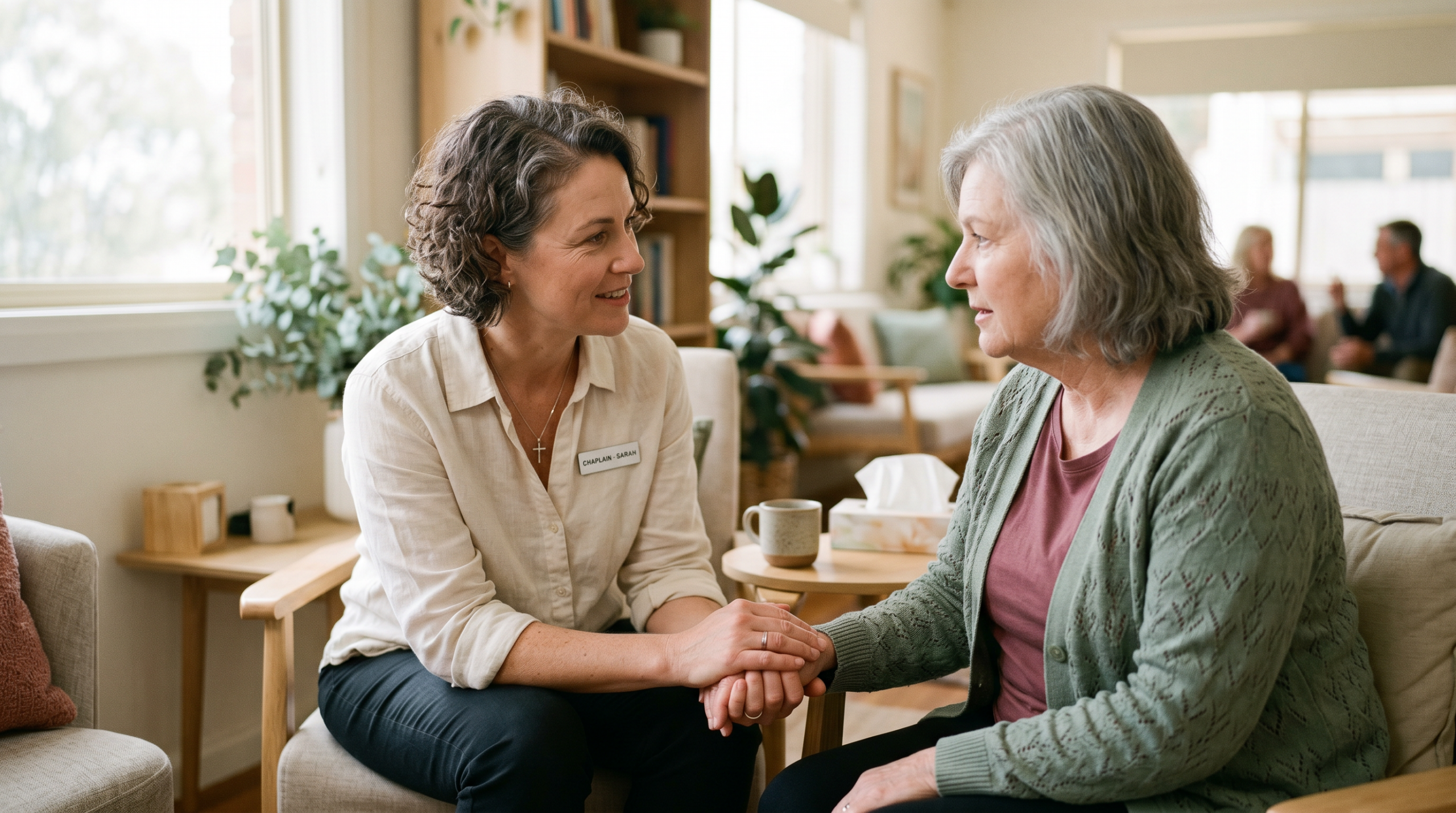 Australian chaplain providing compassionate pastoral care to a person in a community setting